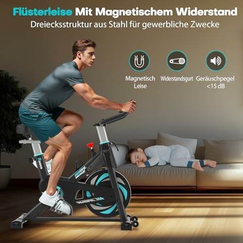 Mann trainiert auf Heimtrainer neben schlafendem Kind